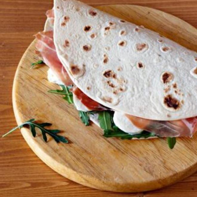 The Piadina sandwhich with ham and cheese typical from Italy and ideal for a quick lunch