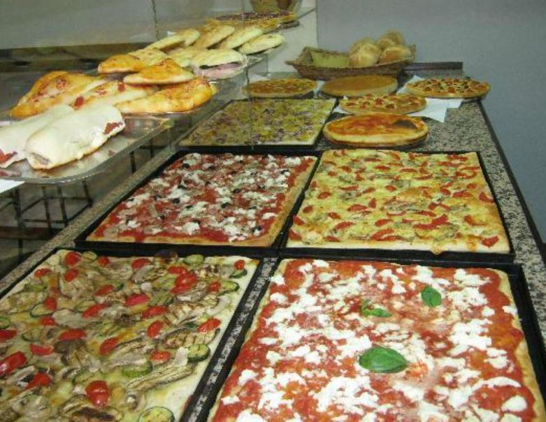 The different Pizza toppings inside Tipica Focacceria Ligure shop in Turin