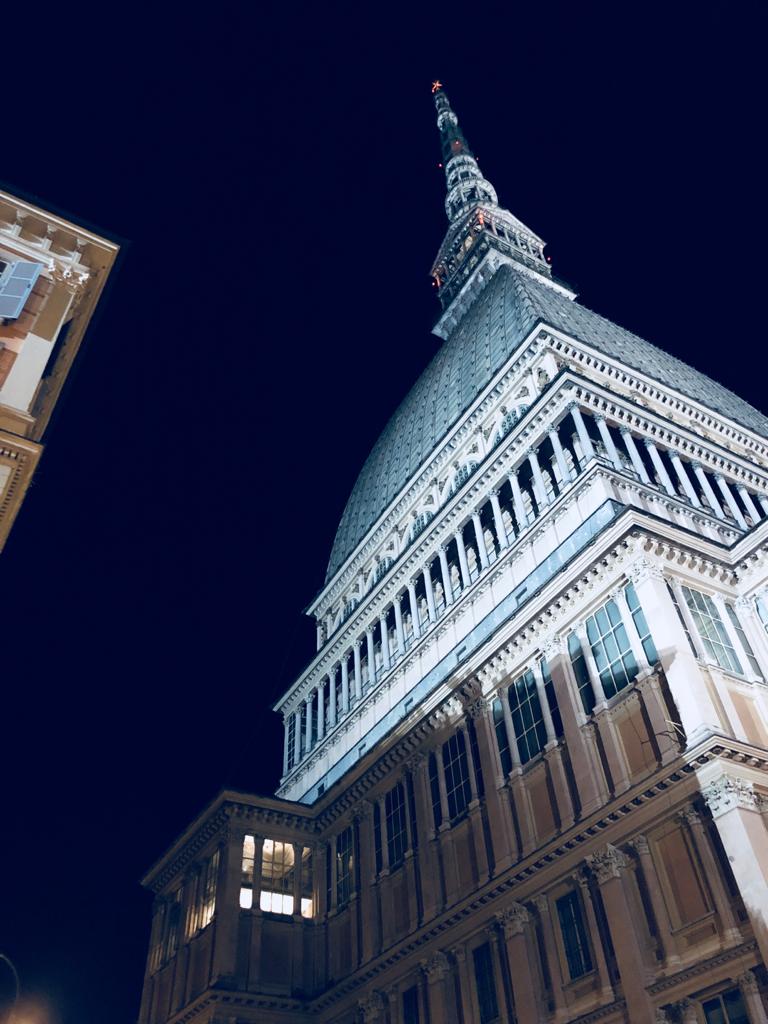 Picture at night of Mole Antonelliana of Turin from the bottom of the tower