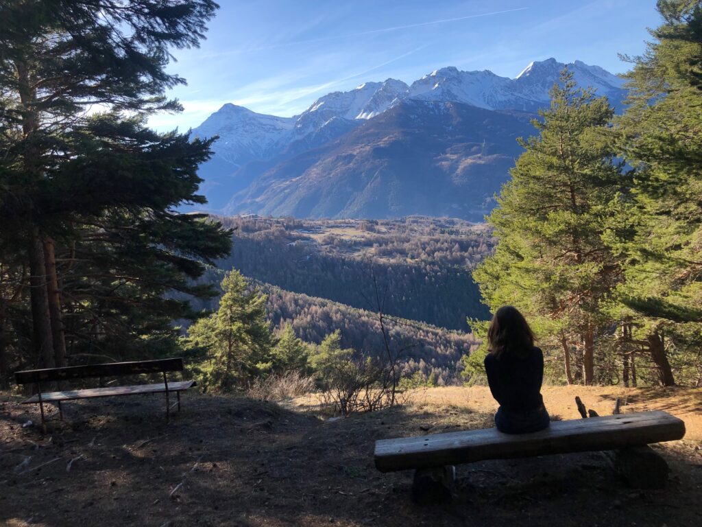 Woman admiring the landscape view in Sauze d'Oulx