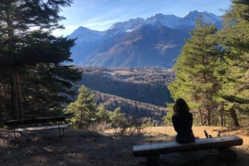 Woman admiring the landscape view in Sauze d'Oulx