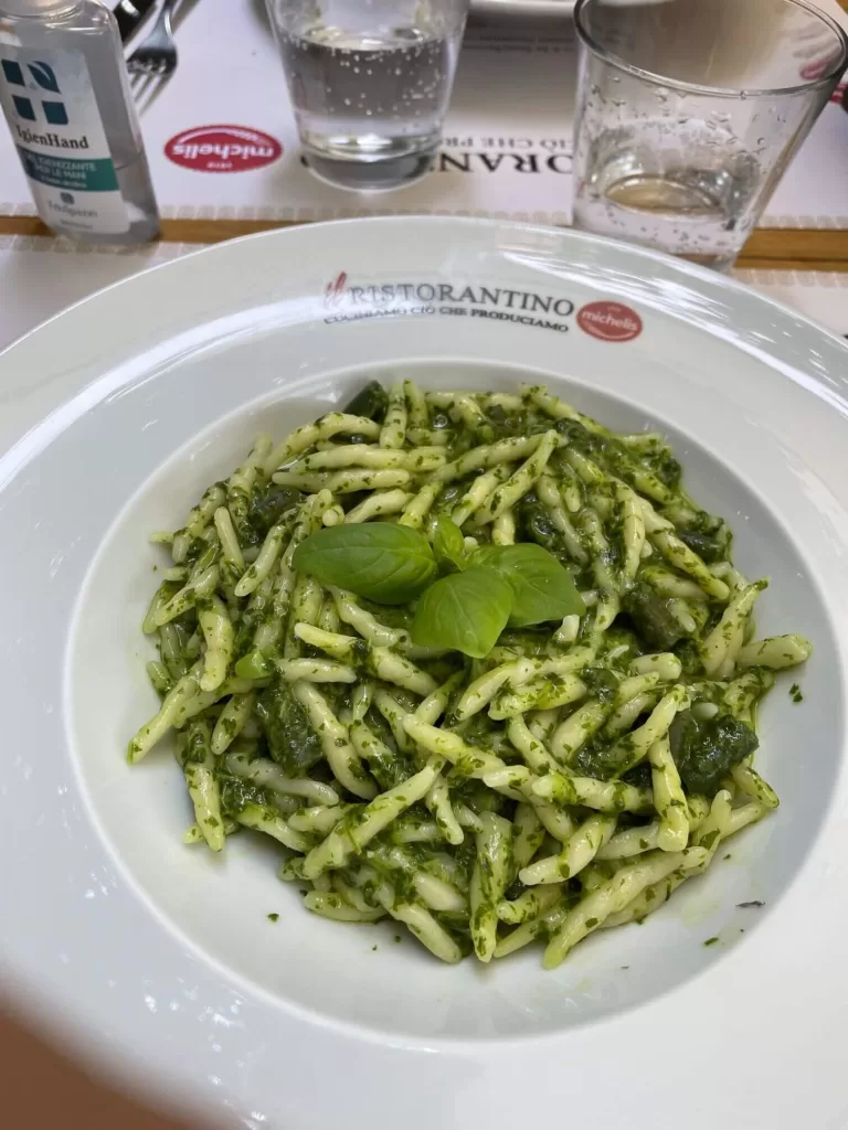 Dish of fresh trofie pasta with pesto sauce