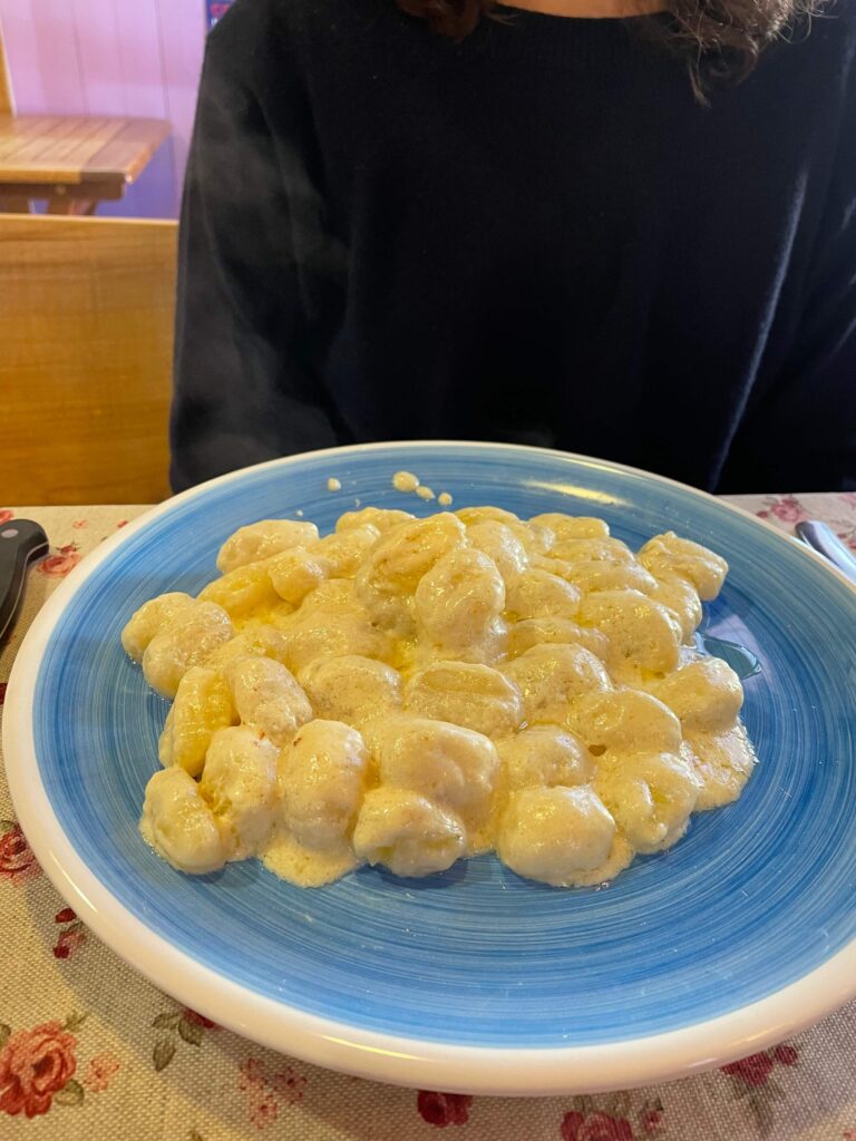 Homemade Gnocchi covered in tasty Castelmagno local cheese