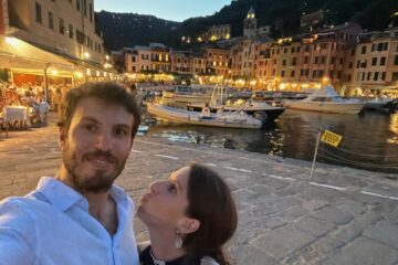 Scenic view of colorful Portofino harbor with boats and pastel buildings