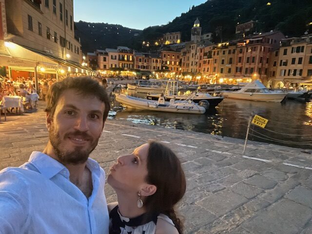 Scenic view of colorful Portofino harbor with boats and pastel buildings