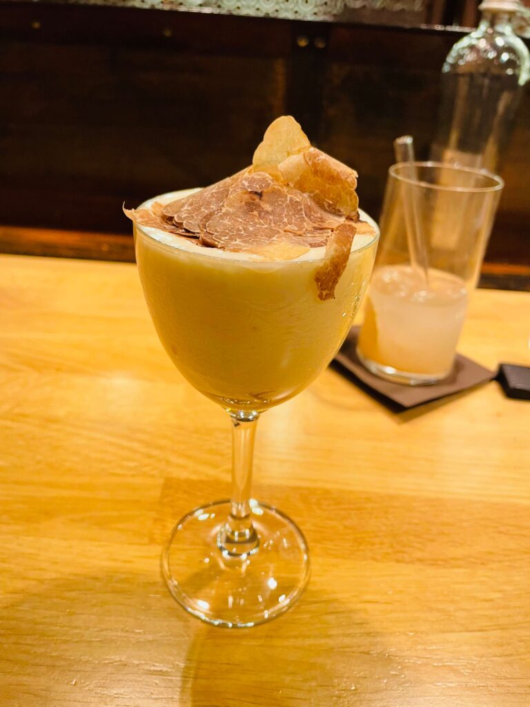 Innovative & Creative Parmigiano served in a luxurious gelato topped with Truffle  